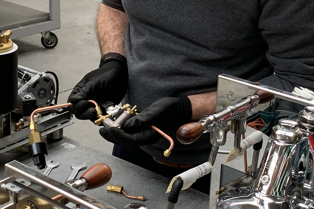Hand assembly of espresso machine in Italy, in Bezzera Espresso machine factory and manufacturer